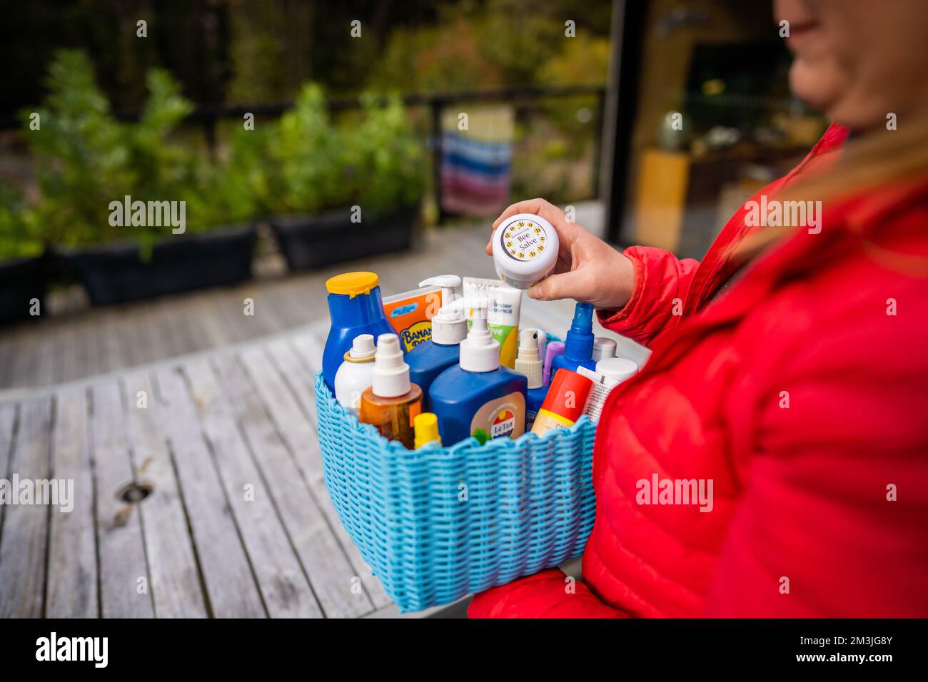 container of sunscreen, buy spray and summer lotions in summer australia in spring Stock Photo