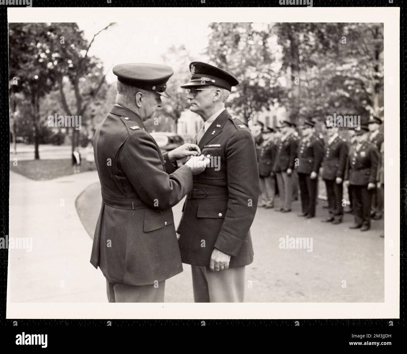 Officer pinning soldier at ceremony , Military parades & ceremonies, Military officers