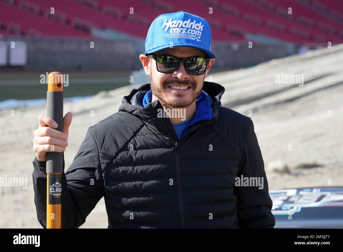 Kyle Larson poses holds a shovel during 2023 Busch Light Clash at the ...