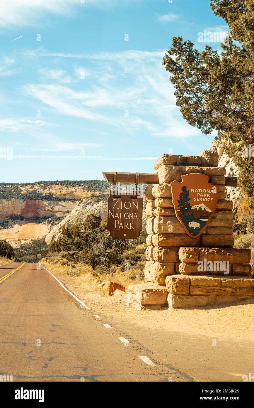 The main entrance sign into zion national park as you drive into the