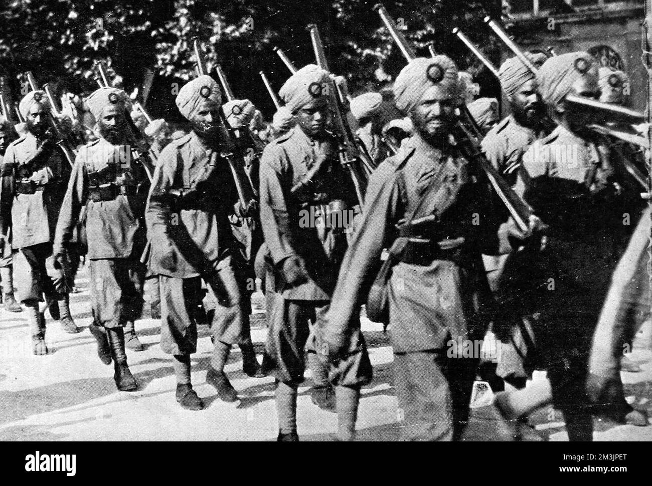 Indian troops on the march in September 1914. The Sikhs are identified by a stell quoit, the old-time national battlefield weapon of the Sikhs, in the Sepoy's turbans. In August 1914, as the German Army advanced through France and Belgium, more Allied troops were desperately needed for the Western Front - and the Indian Army seemed the obvious source. Stock Photo