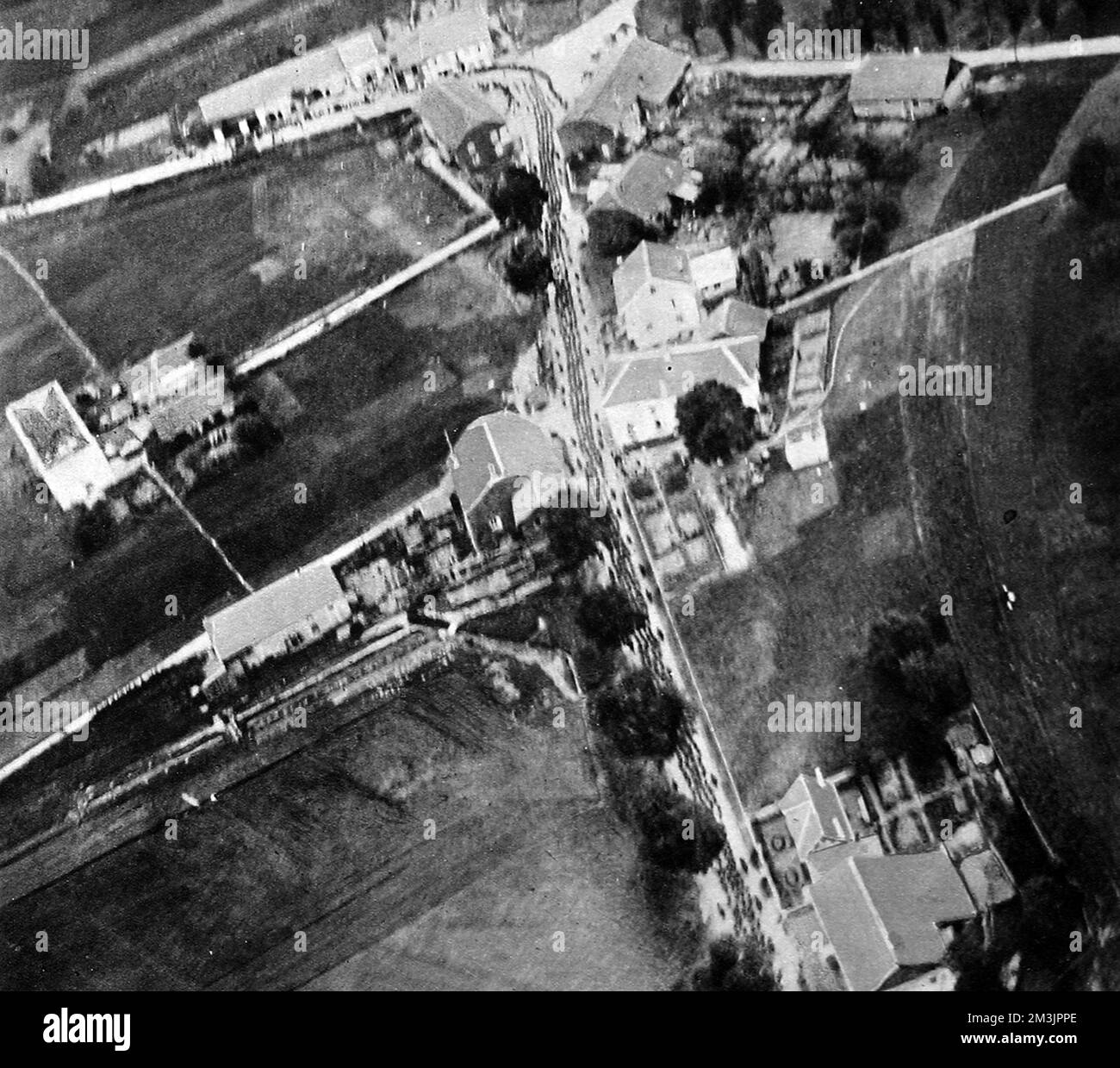 Aerial photograph showing a column of German prisoners marching in