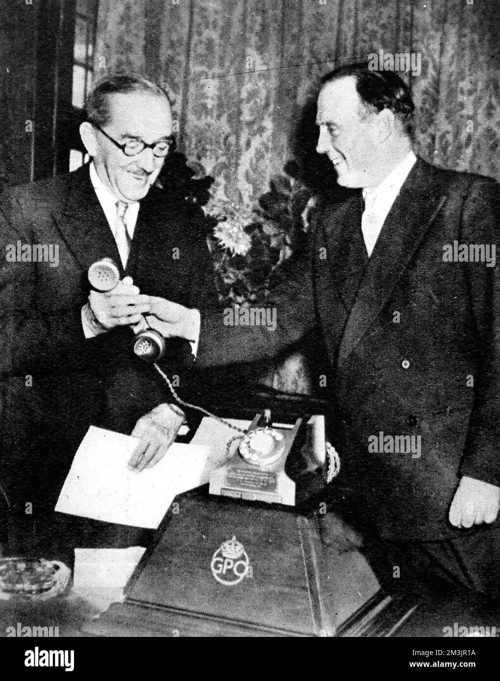 The postmaster general, The Earl de la Warr (right), presents to the