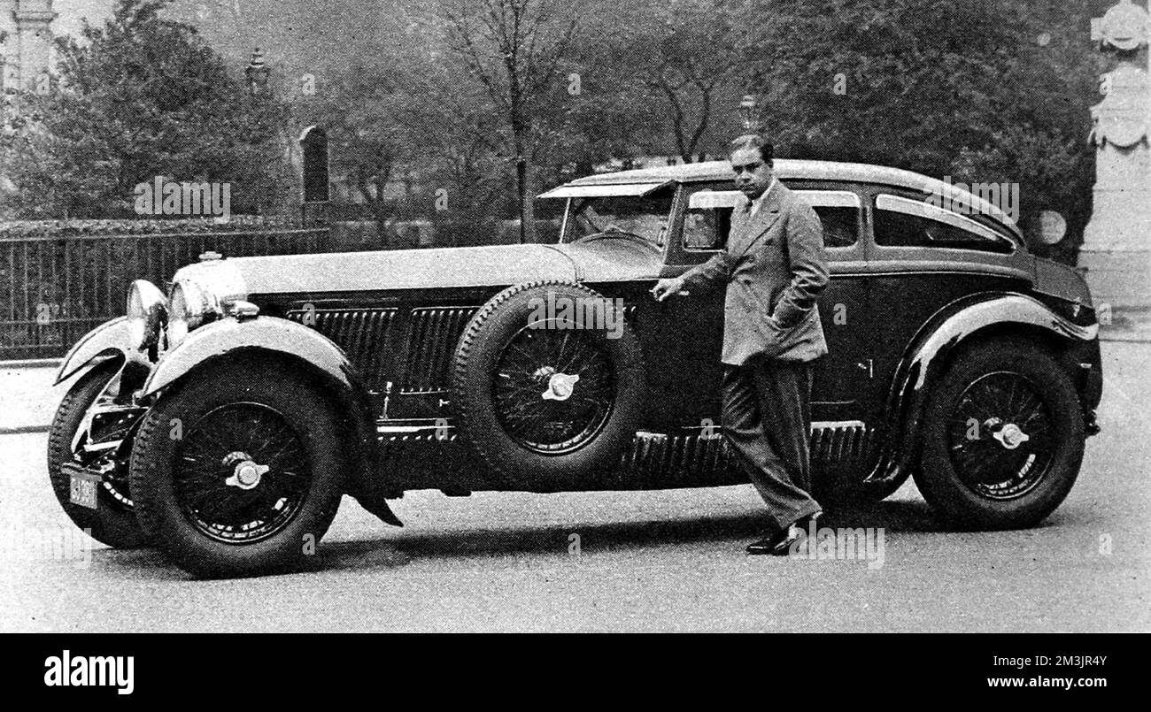 Captain Woolf Barnato with  his 'Speed Six' Bentley fitted with a racing body. Woolf Barnato had just beaten the 'Blue Train' from Monte Carlo to Calais in this (or similar) car. This body is only one if its kind, built by Gurney Nutting. The car still exists.     Date: June 28th 1930 Stock Photo