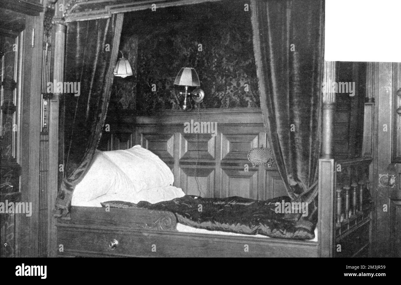 Photograph of a four poster bed in one of the first class bedrooms on