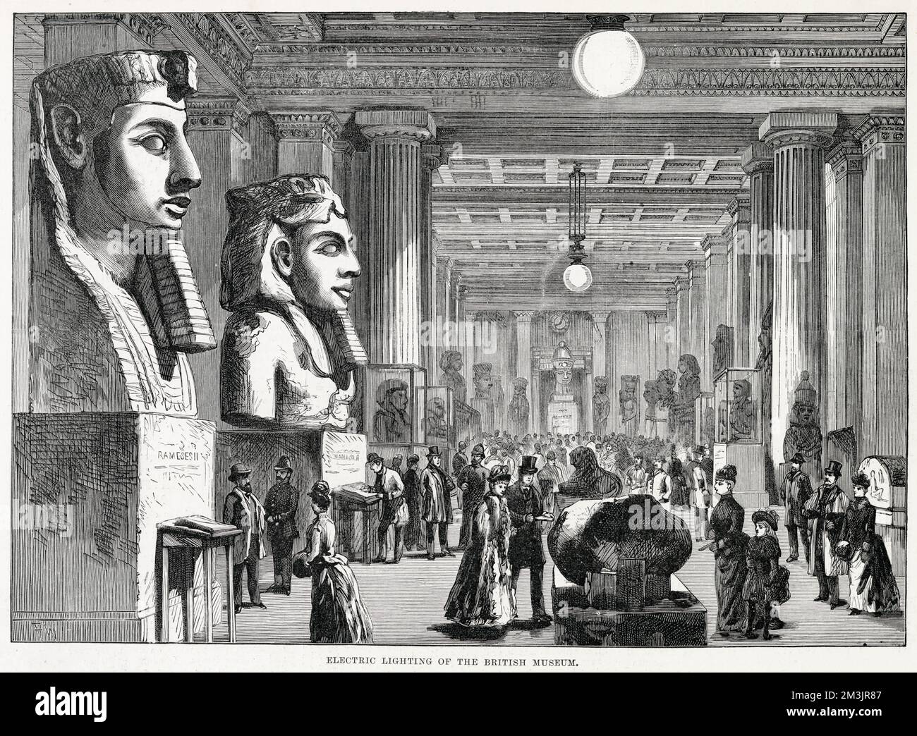British Museum interior of the Egyptian gallery from 1890. Electric lights enabling the museum to be opened to the public in the evenings.     Date: 1890 Stock Photo