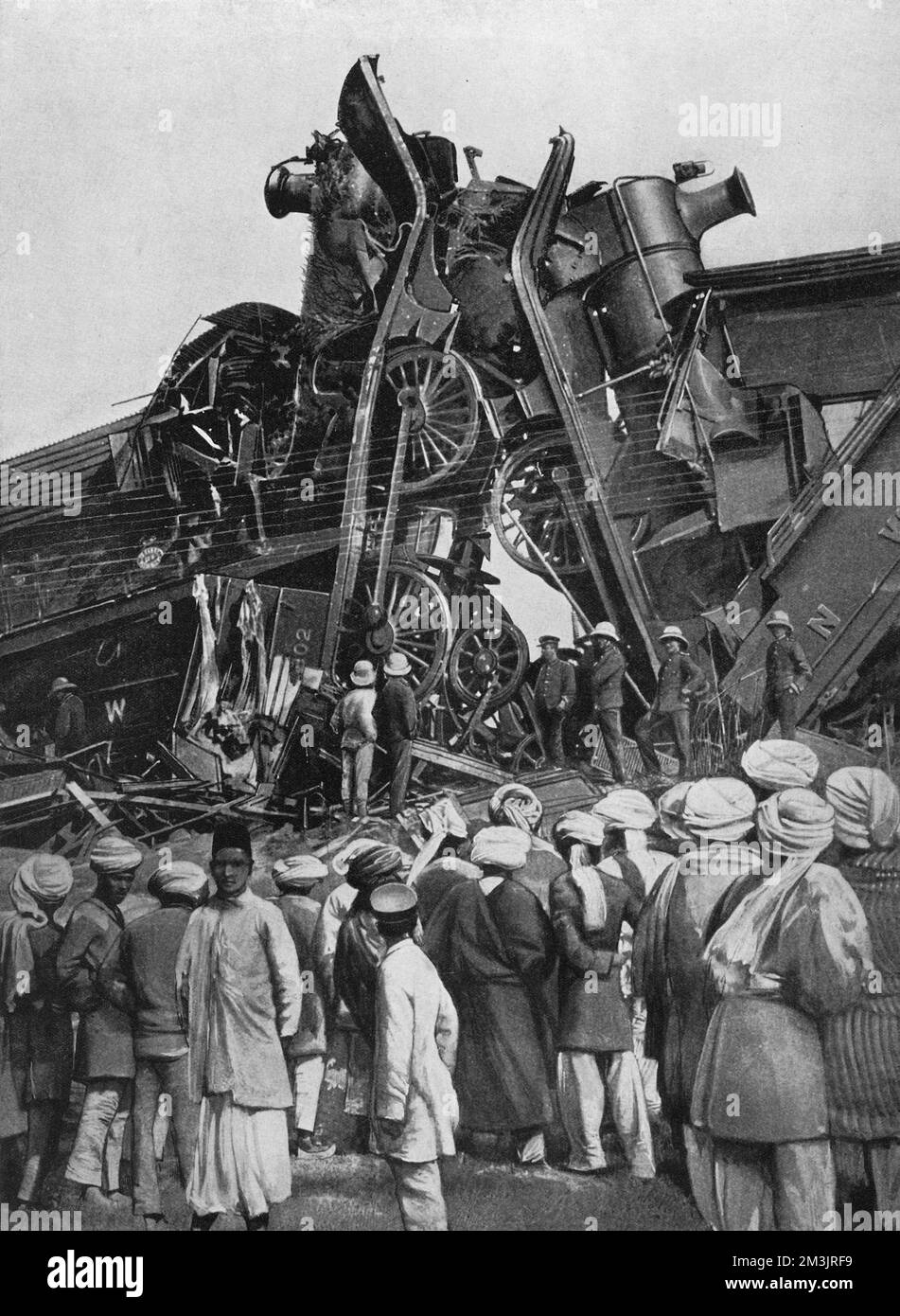 A dramatic sight after two engines collided travelling near Ludhiana, India, resulting in 20 fatalities.     Date: 1908 Stock Photo