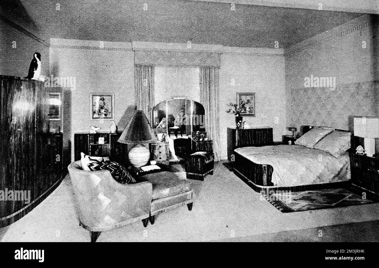 Woman's bedroon. A colour scheme of green, with dark furniture in