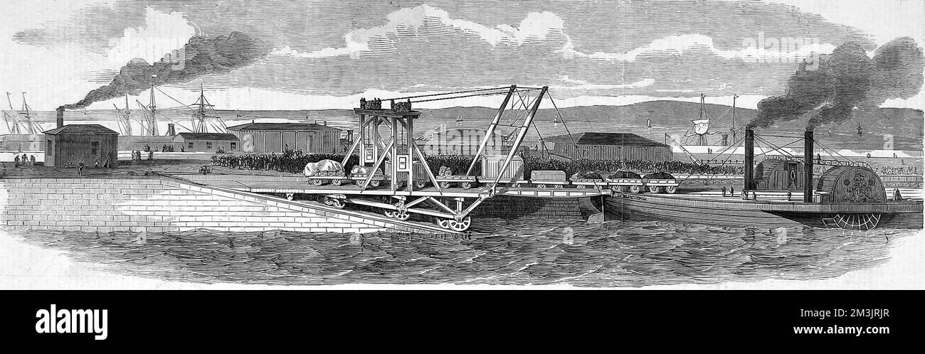 A floating railway across the Forth between Granton and Burntisland. The route designed to carrying goods and live stock without the inconvience of unloading the trucks. The heavy moveable platform is positioned on sixteen wheels attached by universal joints and four iron girders. These girders are raised and lowered on the arrival and departure of the vessel, by a winch that is attached either side. Thwe railway and the engines were constructed by Mr Robert Napier. Stock Photo