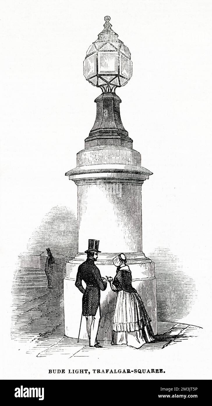 A large Bude light in Trafalgar Square. Invented by Sir Goldsworthy Gurney and patented in 1839, the light worked by introducing oxygen gas into the middle of a standard oil lamp flame. The unburned carbon in the oil flame burned incredibly brightly and an intense, white light was produced from the weak, yellow flame of the oil lamp. A single Bude light was used to light Gurney's castle (in Bude, Cornwall) using a set of prisms and reflectors.     Date: 1839 Stock Photo