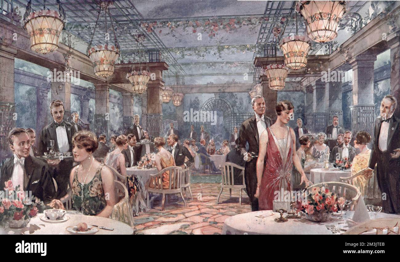 The Garden Grill-Room at the May Fair Hotel in Berkeley Square, Mayfair, London showing diners in black tie and evening dress, attending to by numerous waiters. The special lighting system in the Garden Grill-Room gave the illusion of dining either in daylight or under moonlight, depending on the time of day.  1927 Stock Photo