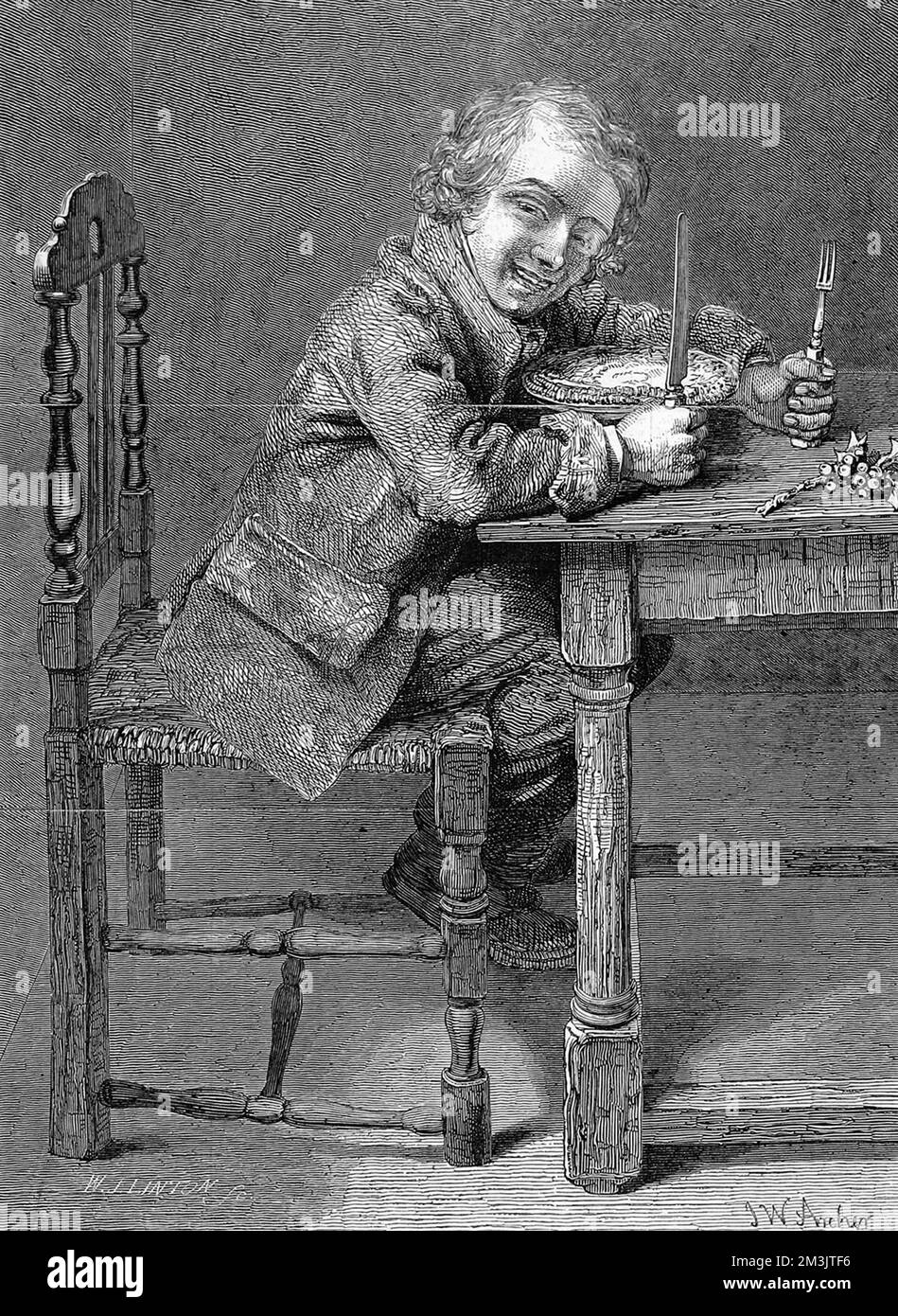 Grinning young man or boy sitting at a table with knife and fork in readiness to eat a Christmas Pie.  1847 Stock Photo