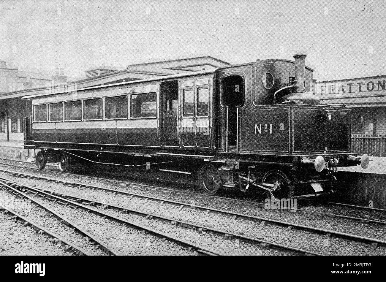 Photograph of the first railway motor-coach in Britain, June 1903. The London and South-Western Railway were experimenting with motor-coaches for light suburban traffic. This coach was fifty-six feet long, with two compartments - one for 10 first class passengers and the other for 32 third class passengers.  1903 Stock Photo