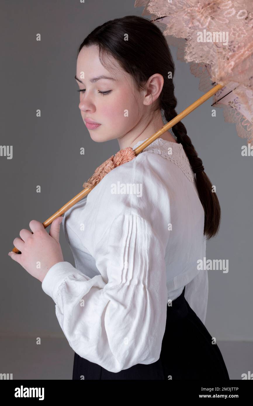 A Victorian or Edwardian woman wearing a white linen Garibaldi blouse ...