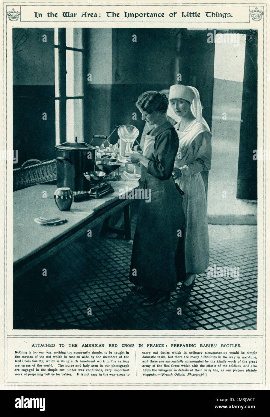 American Red Cross nurses in France, preparing bottles for babies under war conditions.  1917 Stock Photo