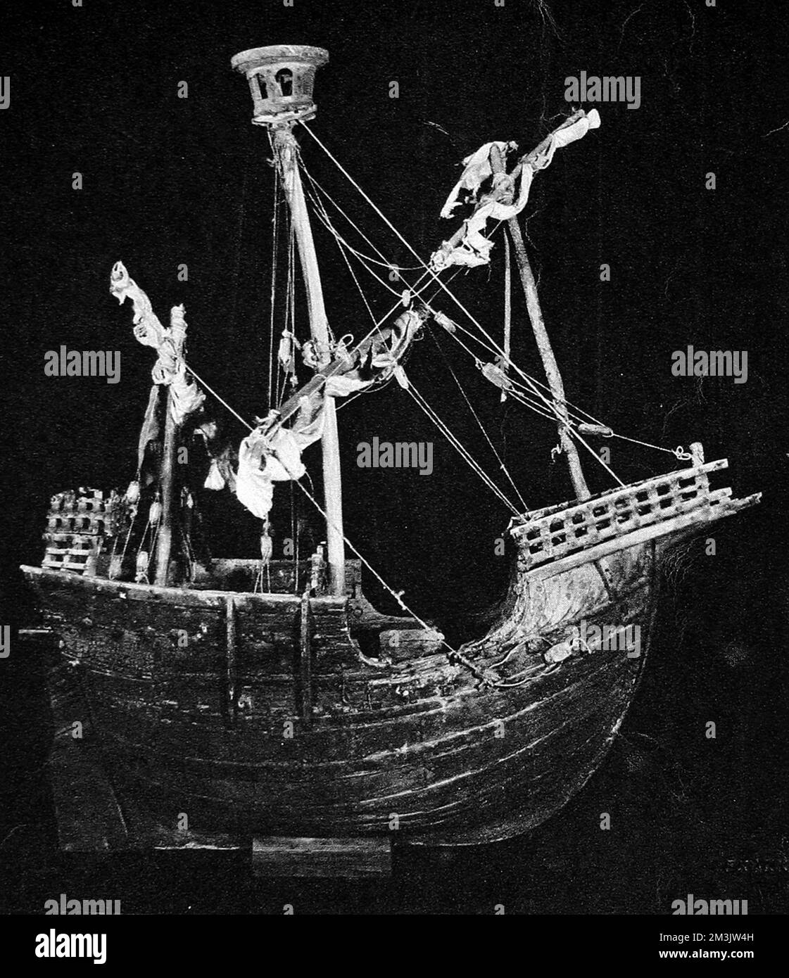 Photograph of a ship model, probably built circa 1450, that was hung as a Votive offering in the Chapel of the town of Mataro, Catalonia, Spain.  By 1930 this model was in The 'Prins Hendrik' Maritime Museum, Rotterdam, having been bought from the Reinhardt Galleries, New York. This was an extremely rare model of a 15th century ship made at the time.     Date: 1930 Stock Photo