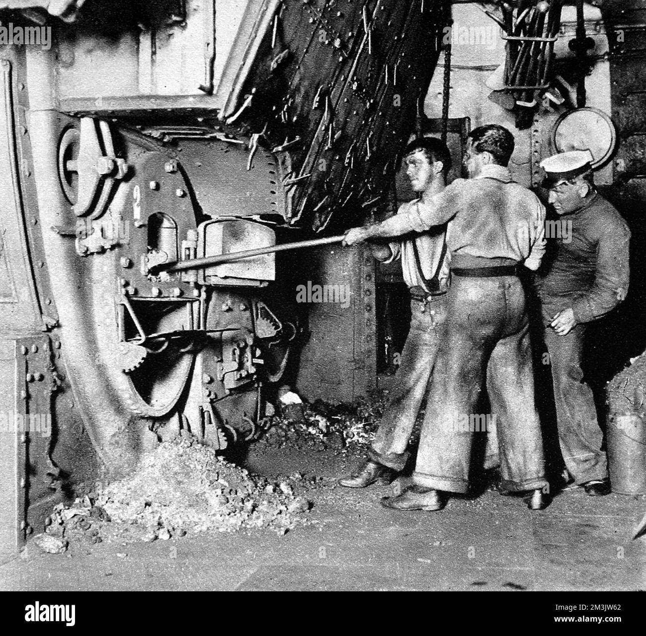 Stokers working in the stokehold of a British Warship, 1913. 1913