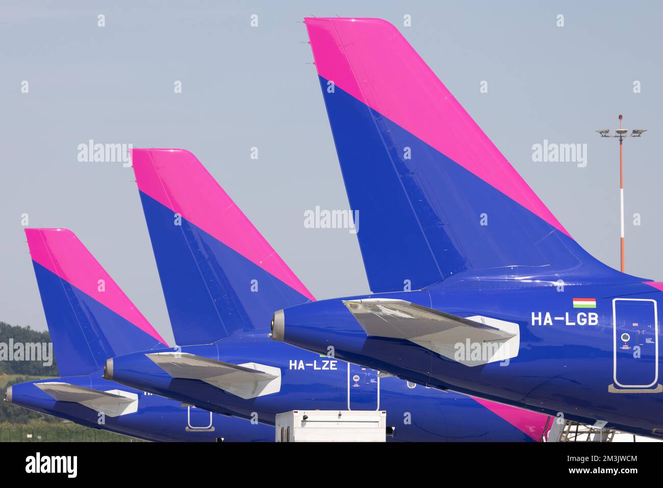 A beautiful view of Three Airbus A321 NEO ULCC Wizz Air based in row, Cracow, Poland Stock Photo