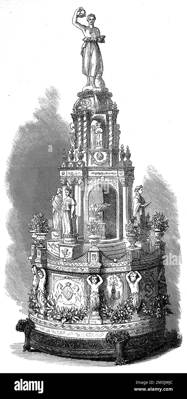 Wedding cake at the marriage of Princess Louise to the Marquis of Lorne in 1871. Made by Queen Victoria's chief confectioner at Windsor Castle, the cake measured 5 feet, 4 inches high with a diameter of 2 feet, 6 inches. The based was decorated with white satin, bearing coats of arms, the initials, 'L.L' entwined with blue, wreaths of orange-blossom and small vases containing the same flowers. All the figures and ornaments were of sugar. The presentation cakes for the Royal family and 300lb of wedding cake for distribution were made by Messrs. Gunter and Co. of Berkeley Square, London.     Dat Stock Photo