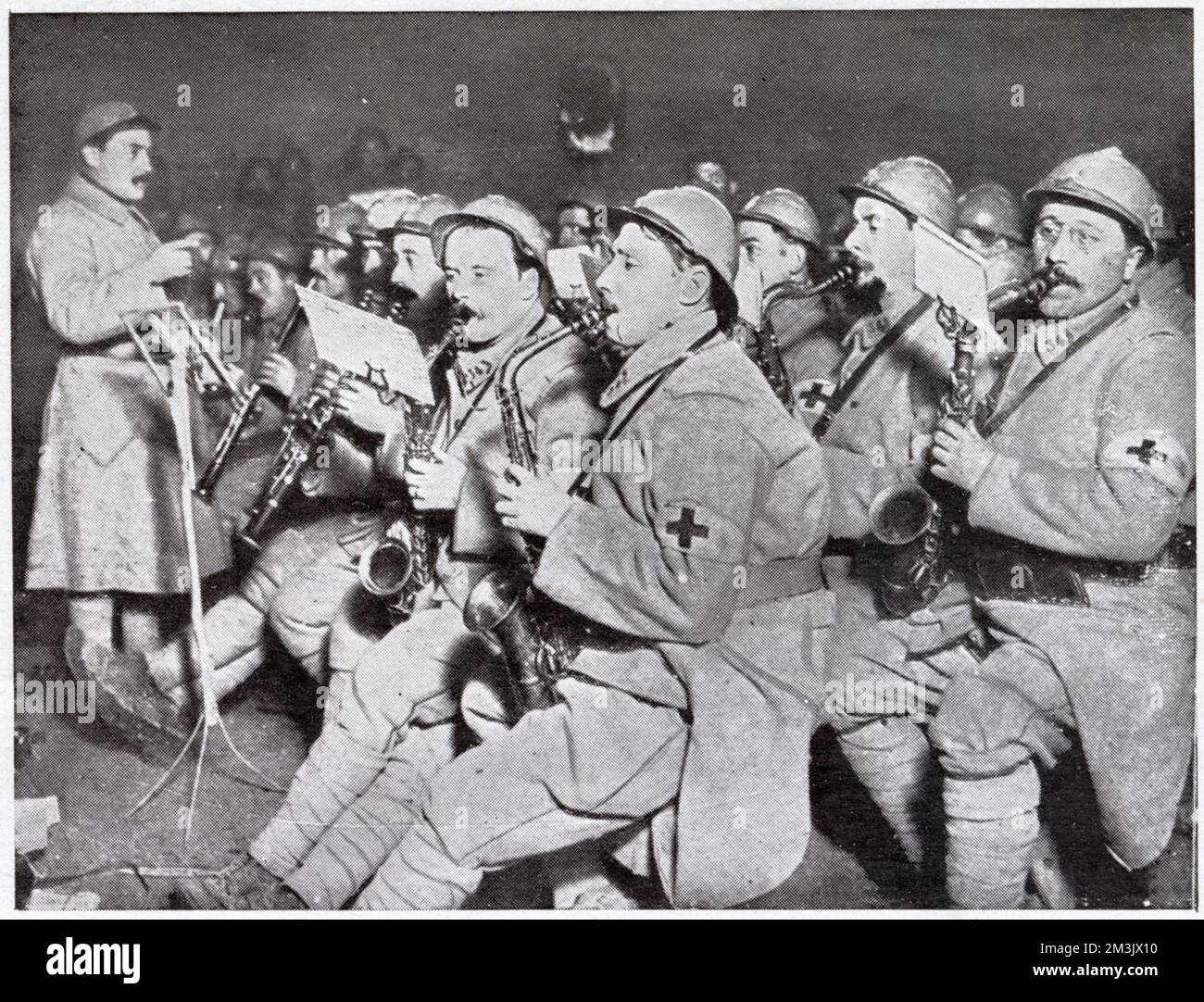 Red Cross stretcher-bearers during the day, musicians by night. The military bandsmen play their saxophones and clarinets, for entertainment. Stock Photo