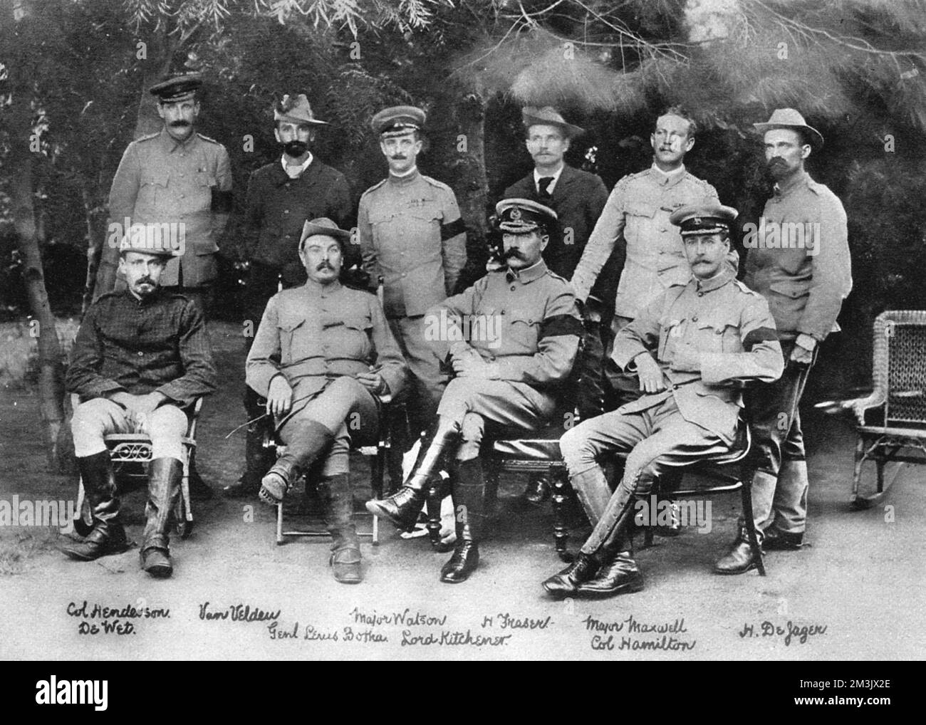 Lord Kitchener (1850 - 1916), seated at the peace conference that brought the Boer War of 1899-1902 to an end. Kitchener became Commander-in-Chief of the British war effort in South Africa from 1900. Also among those present is General Louis Botha (1862-1919) who commanded the Boer forces during the war and in 1910 became first premier of the Union of South Africa.     Date: 1902 Stock Photo