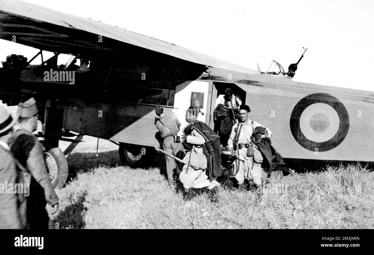 Photograph showing Moroccan troops of General Franco's Army of Africa disembarking from an aeroplane in Spain, 1936.      At the start of the Spanish Civil War, the Nationalist Army of Africa was based in Morocco and had to be taken to Spain by aeroplane, as the Spanish navy had remained loyal to the Republican Government.     Date: 1936 Stock Photo