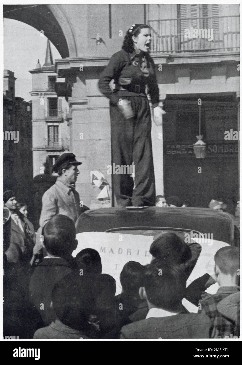 A female Republican supporter giving a speech on top of a car, Madrid, 1936. It was reported that she was calling for more volunteers to join the Republican army. Stock Photo