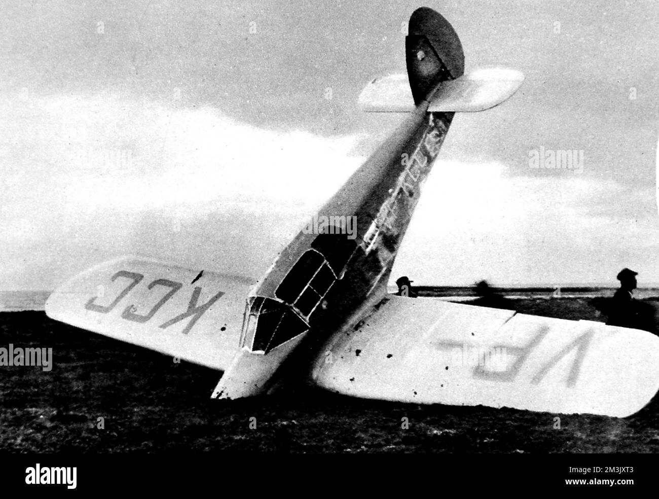 Photograph showing Mrs. Beryl Markham's (1903-1986) aeroplane stuck in a bog on Cape Breton Island, Nova Scotia, 1936.      This was the end of Mrs. Markham's flight from RAF Abingdon, in England, to North America, whereby she became the first woman to fly the Atlantic solo from East to West.  Mrs. Markham was, fortunately, unhurt in the landing.     Date: 1936 Stock Photo