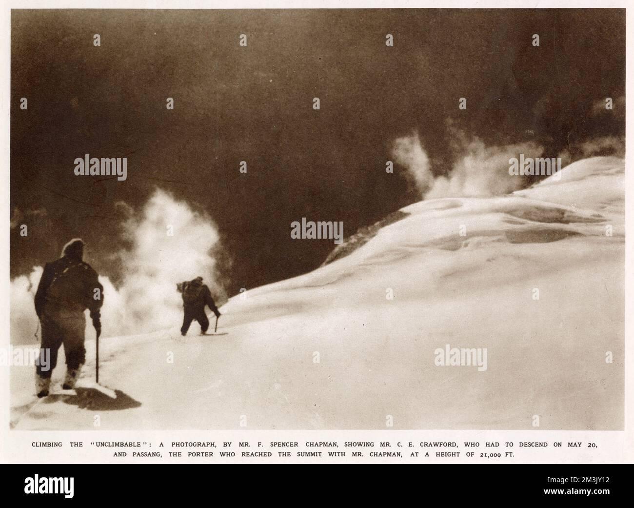 Photograph showing two climbers on the 24,000 ft. Himalayan mountain 'Chomolhari', near Phari Dzong, Bhutan, 20th May 1937.   The photograph, taken by F. Spencer Chapman, shows C.E. Crawford and Passang Dawa climbing the mountain at about 21,000 ft. Spencer Chapman and Passang Dawa became the first climbers to reach the summit, the following day. Stock Photo