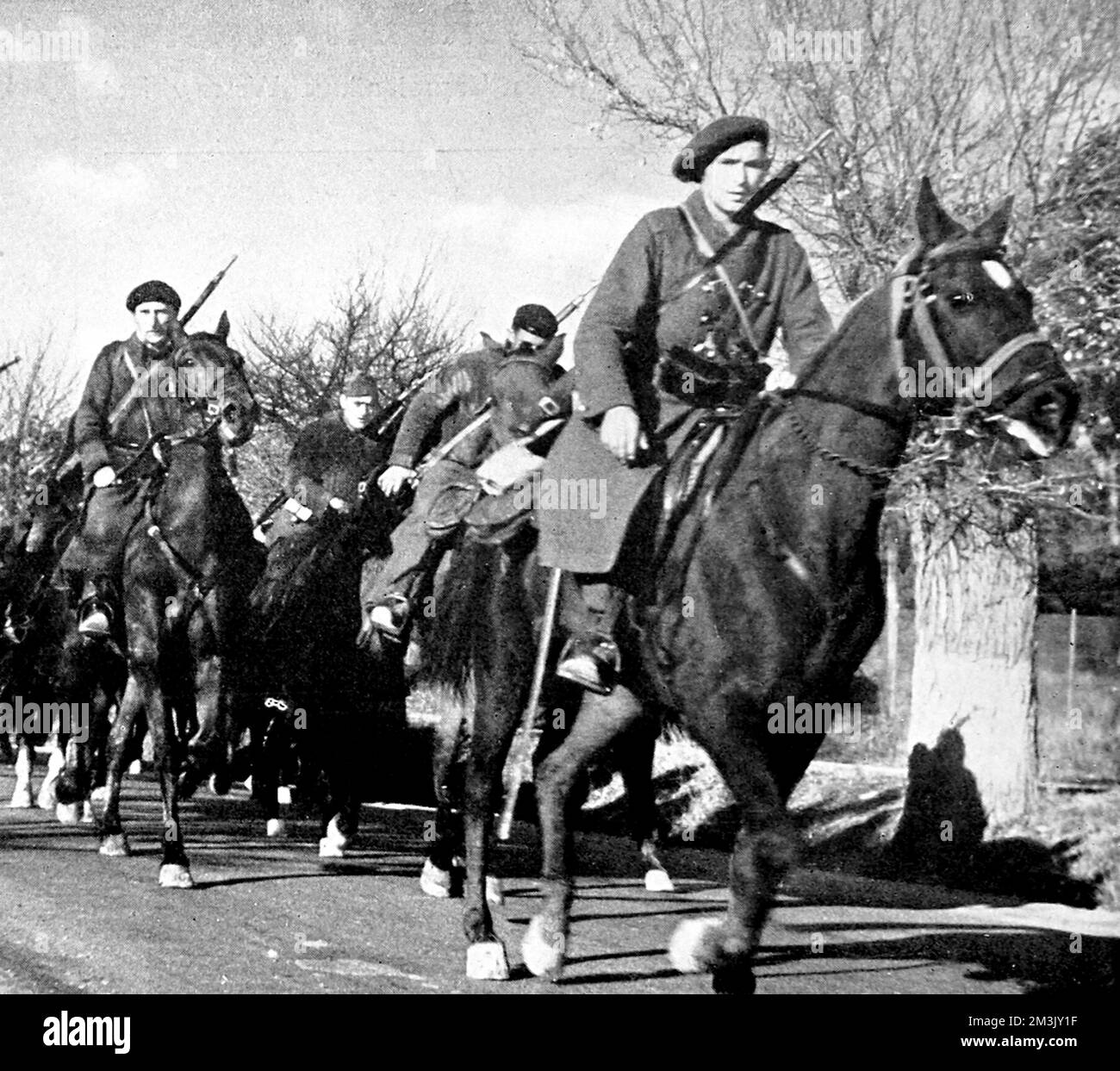 Photograph showing members of the Hungarian cavalry unit of the International Brigade, shown on their way to the Madrid front, during the Spanish Civil War, 1937.      The International Brigade was made up of volunteers from all over Europe and North America, who went to Spain to fight for the Republican Government.     Date: 1937 Stock Photo