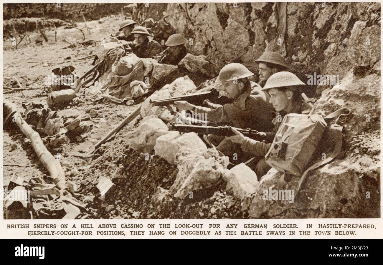 A group of British soldiers dug in to a position near Monte Cassino, Italy, in 1944.  Between January and May 1944 the Benedictine monastery of Monte Cassino and the nearby town were completely destroyed as the Allied Fifth Army attempted to push the occupying Nazi troops out of their strong defensive position, in the monastery. Stock Photo