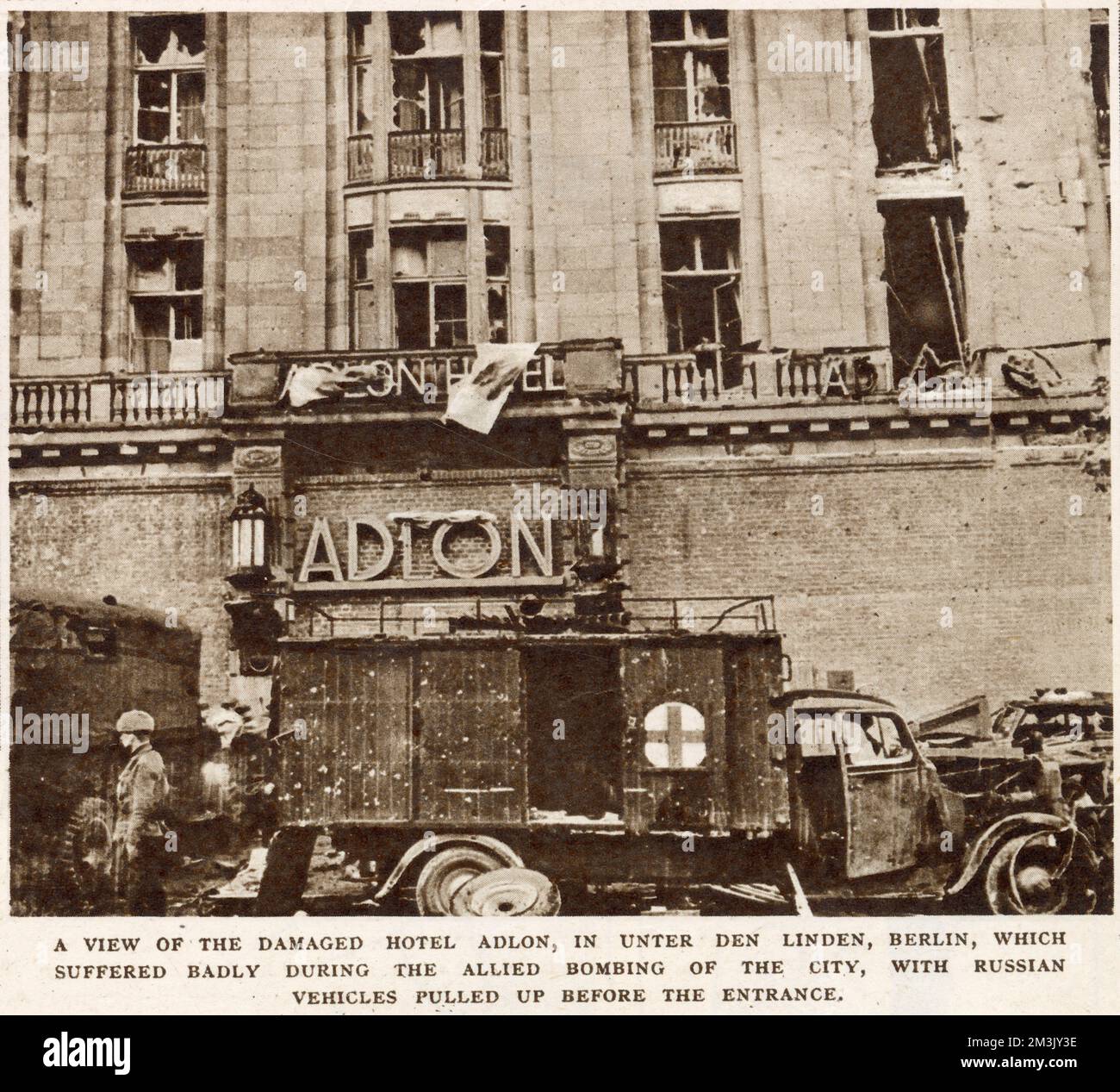 The heavily damaged Hotel Adlon, in Unter den Linden, Berlin, with Soviet vehicles in front of the entrance, May 1945. Stock Photo