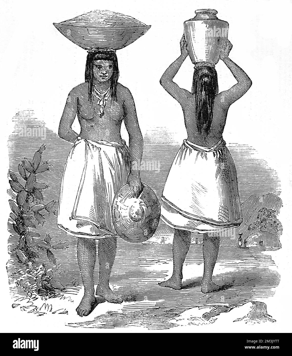Two native American Indian women of the Pimo tribe carrying baskets and water vessels on their heads, wearing full wrap around skirts and heavy jewellery. Stock Photo