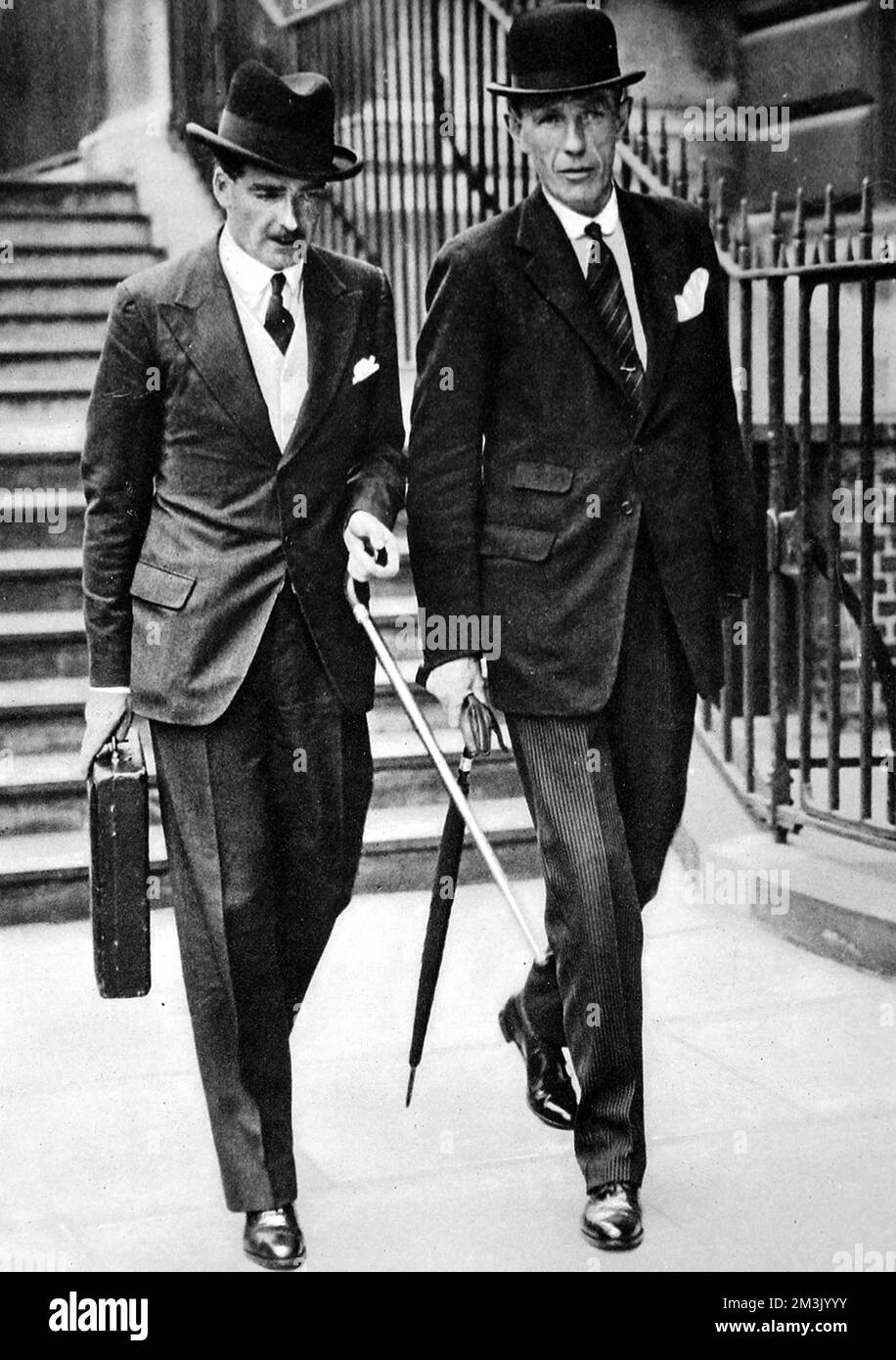 Anthony Eden (on left) (1897 - 1977) and Viscount Halifax (1881 - 1959) in London. Halifax had just replaced Eden as Foreign Secretary, after Eden's resignation from Chamberlain's cabinet over differences in belief regarding British policy towards Fascist Italy.  1938 Stock Photo