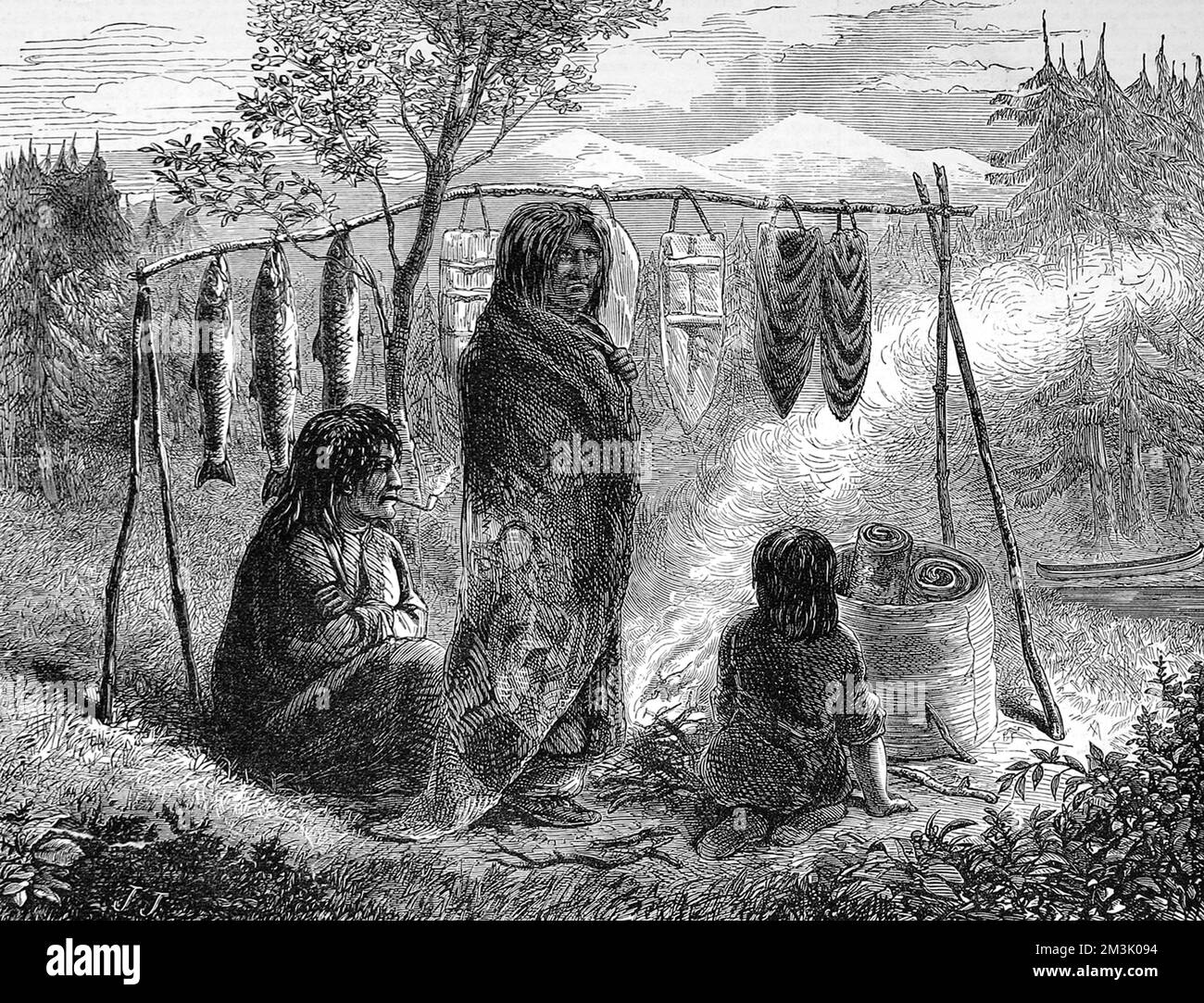 American Indians cooking or drying salmon on a wooden frame over a camp fire.     Date: 1872 Stock Photo