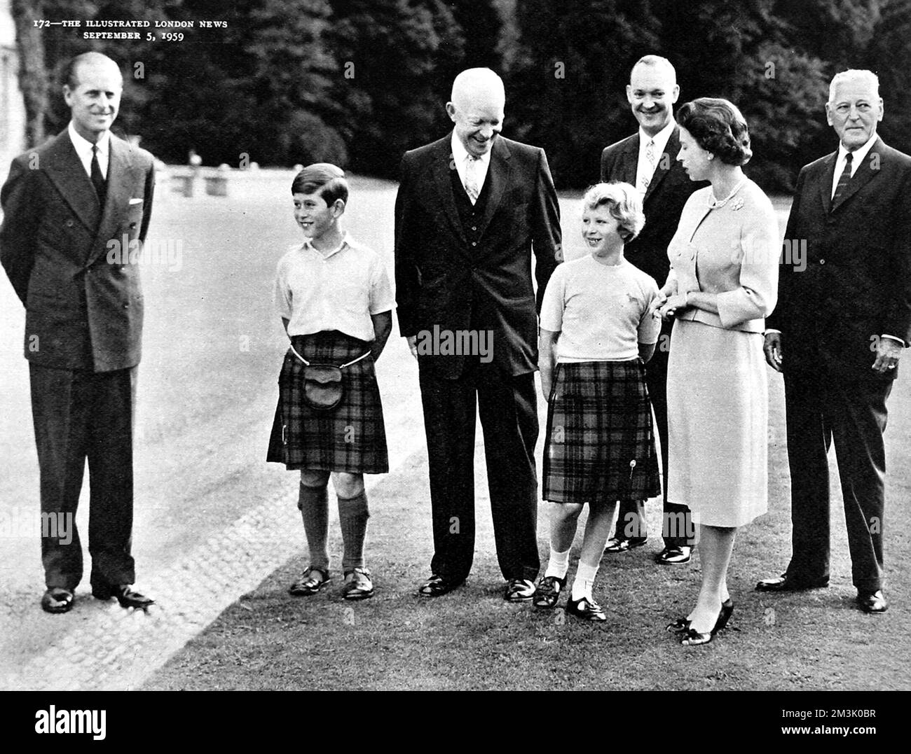 Photograph showing (from left to right): Prince Philip, Prince Charles, Dwight D Eisenhower, Princess Anne, John Eisenhower and Queen Elizabeth II, on the lawn of Balmoral Castle, August 1959.     Date: 1959 Stock Photo