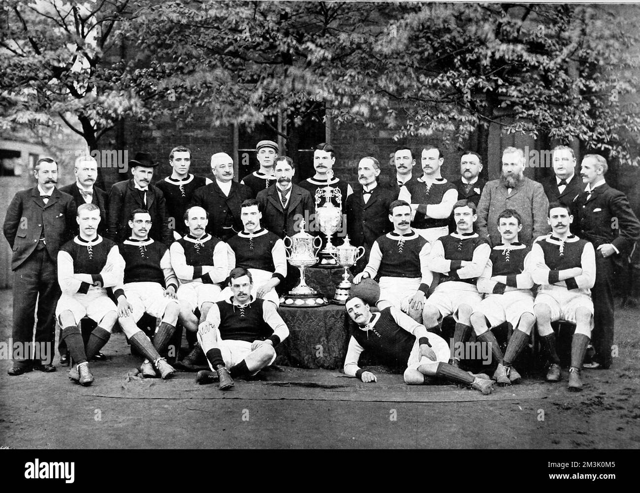 Aston Villa Football Club, with the team for the 1896-1897 season.  The photograph shows:  Back row, left to right: G.B. Ramsay (Secretary), Dr. V.A. Jones, J.Grierson (Trainer), H.Spencer, F.Cooper, T.Wilkes, J. Ansell (President), D. Hodgetts, J.E. Margoschis (Chairman), C.S. Johnstone, J. Welford, I. Whitehouse, W. McGregor, J.T. Lees, F.W. Rinder. Middle row, seated, left to right: R. Chatt, J.W. Crabtree, J. Reynolds, Jas. Cowan, J. Devey (Captain), F. Burton, D. Athersmith, J. Campbell. Front row, on ground, left to right: S. Smith, John Cowan.  1896 Stock Photo
