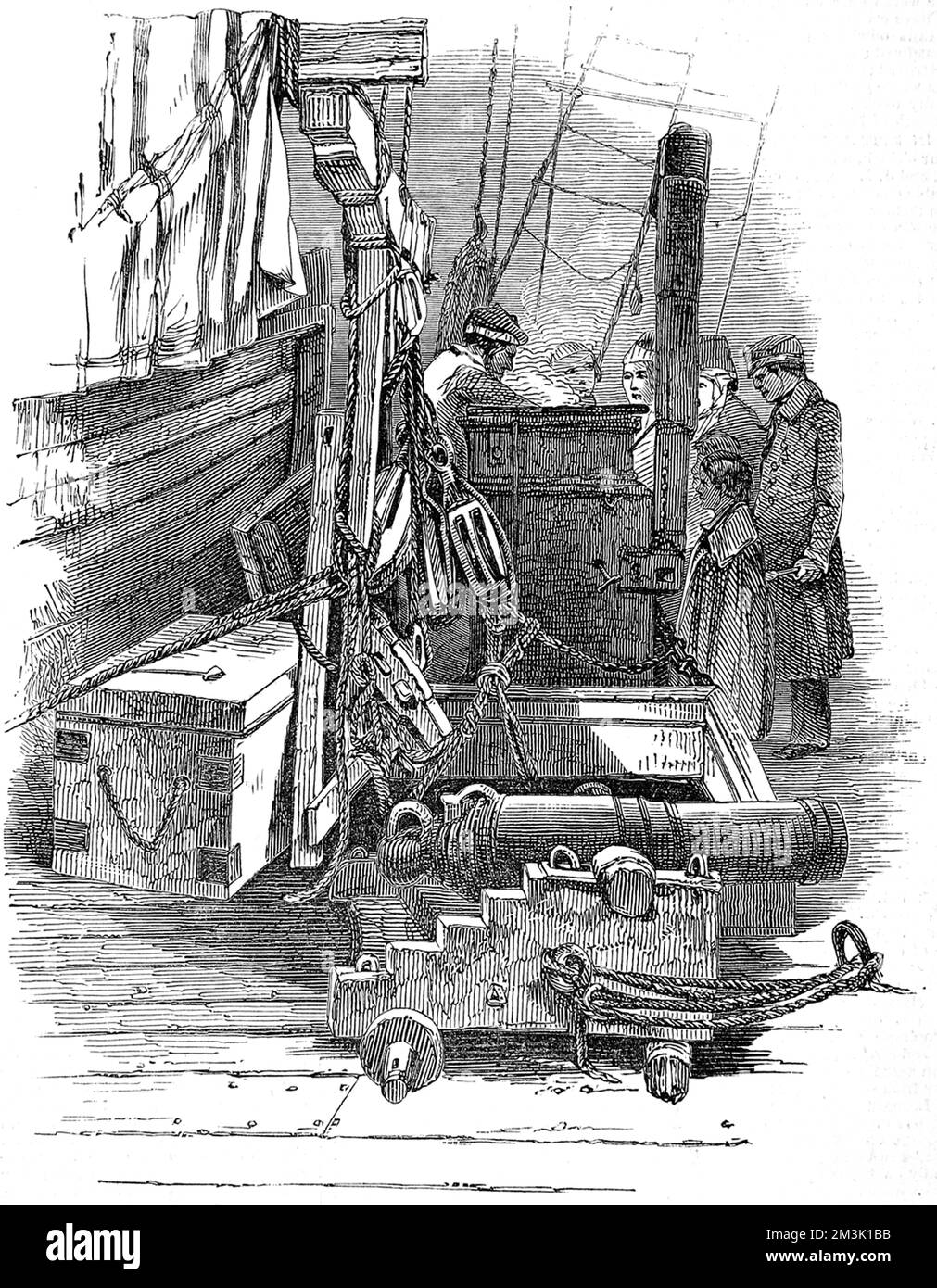 The galley on the deck of an emigrant ship, where passengers are being doled out soup. In the foreground is a cannon and a door down to the hold with lifting gear.  1849 Stock Photo