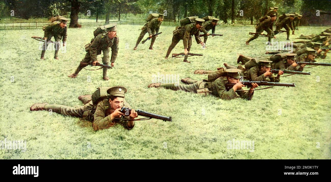 British infantry are shown in a firing line during an exercise. The colour photograph was published by the Illustrated London News to show their readers how the British khaki uniforms appeared against a European landscape.     Date: 1916 Stock Photo