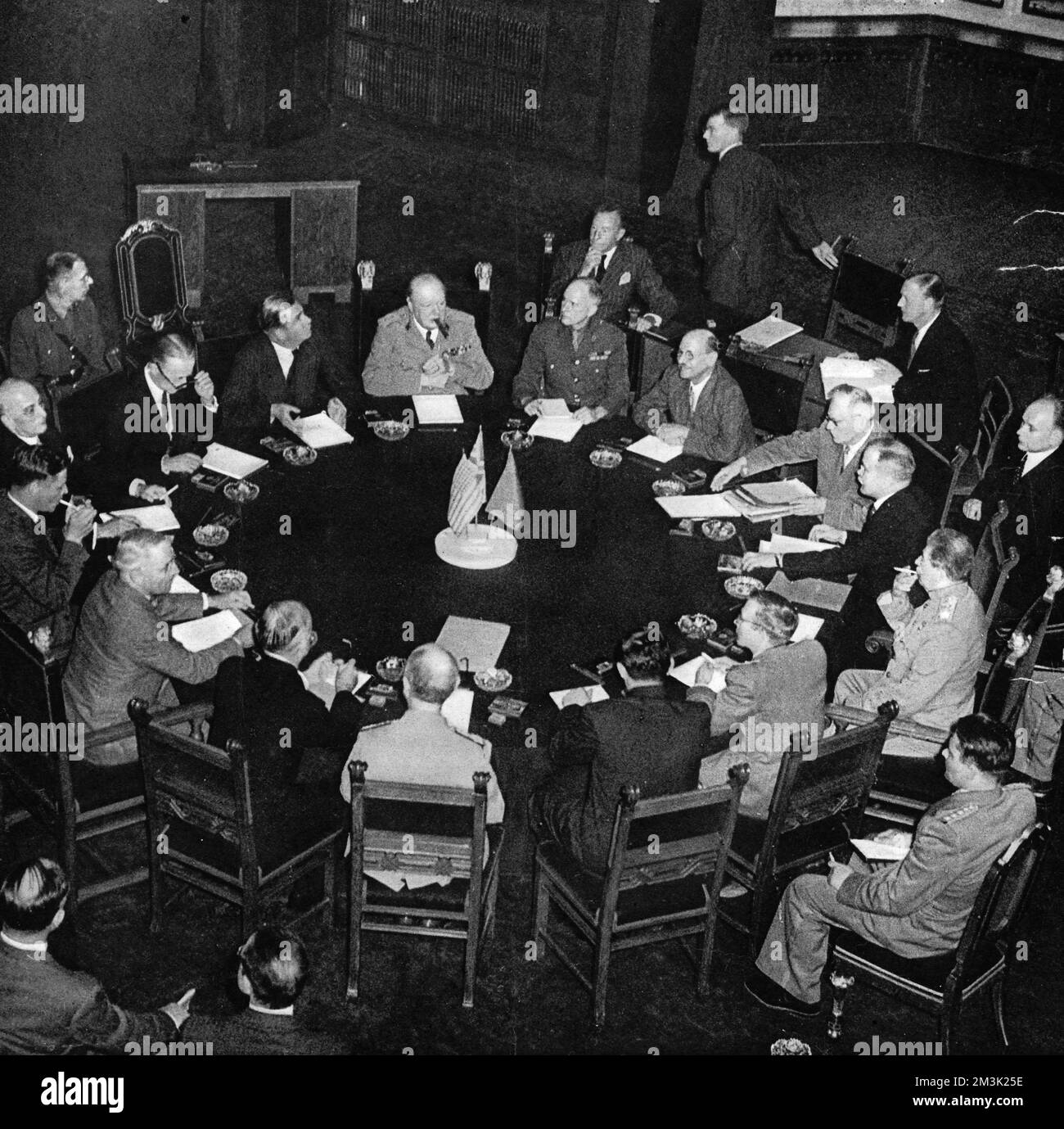 Photograph showing the leaders of Great Britiain, the Soviet Union and the United States of America meeting at the Potsdam Conference, July 1945.    Winston Churchill and Anthony Eden, the British representatives, are shown seated at top left of the image.  President Truman of the USA, at bottom left of the table, and Generalissimo Stalin of the USSR, at right of the image.    This confererence, the last to be held between these three countries before the Cold War, was convened to decide the post-war fate of Germany.     Date: 1945 Stock Photo