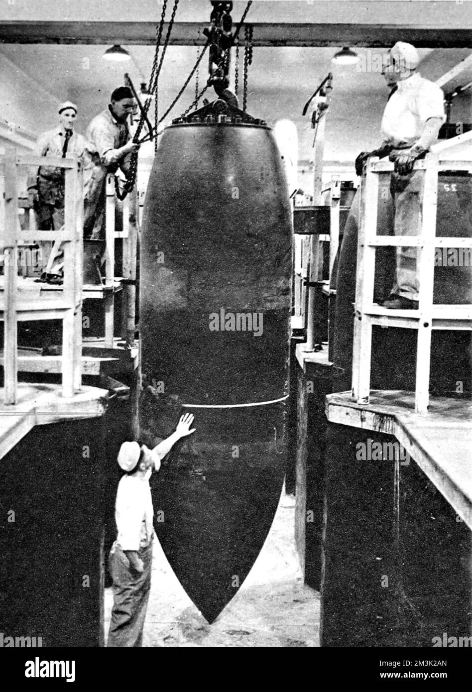 A British 10ton bomb being moved along the production line at an