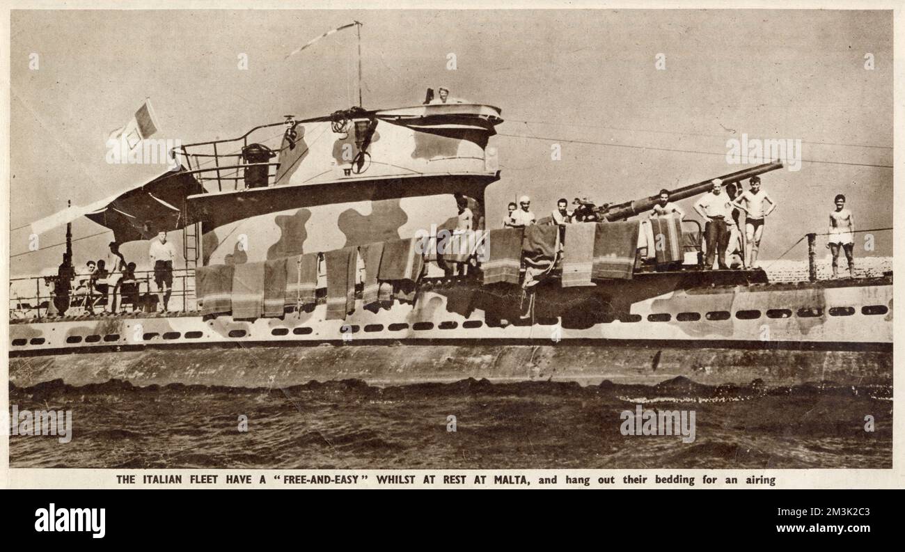 The crew of an Italian submarine airing their blankets and bedding on arrival at Malta in 1943.   When Italy fell that year, much of the Italian fleet attempted to reach Allied bases to surrender their vessels to the Allies, rather than give them to the Germans. Stock Photo