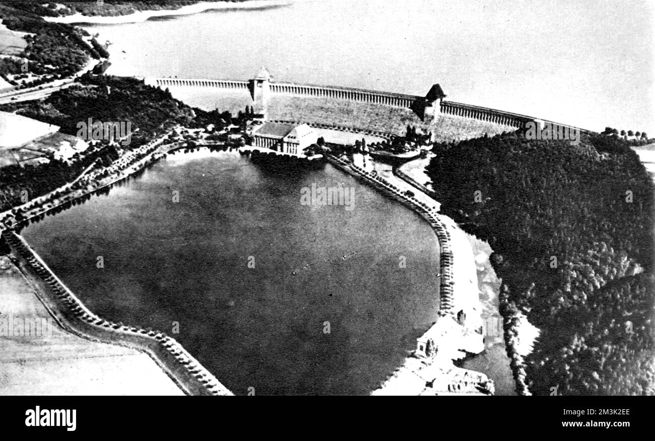 Aerial photograph showing the Mohne Dam and reservoir (top) before the 'Dambusters' raid of May 1943. This photograph was probably taken before the Second World War as there are no obvious signs of German military protection of the dam.  On 16th May 1943 Royal Air Force 'Lancaster' bombers of 617 Squadron attacked and breached this dam during an operation which later became better known as the 'Dambusters' Raid.     Date: 1943 Stock Photo