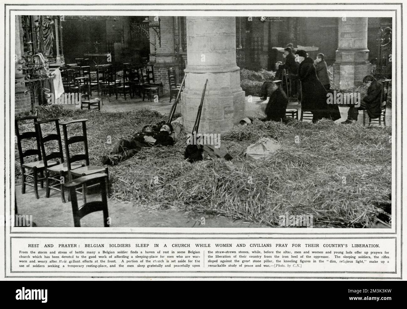 Belgian soldiers sleep in a church while women and civilians pray for their country's liberation.  1914 Stock Photo