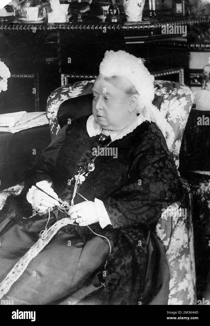 Photographic portrait of Queen Victoria (1819-1901) of Great Britain and Ireland and Empress of India, pictured knitting c.1890.     Date: c.1890 Stock Photo