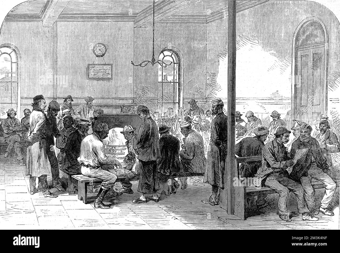 The interior of one of the rooms of the 'Strangers Home for Asiatics, Africans and South Sea Islanders' in West India Dock Road, Limehouse, London.  This home offered accommodation to the foreign sailors and servants arriving at the London Docks in their thousands every year, at that time.     Date: 1870 Stock Photo