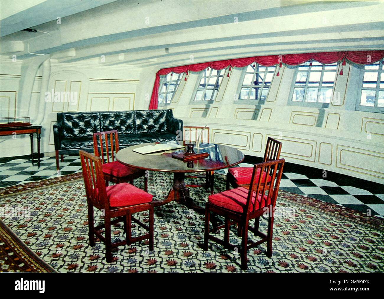 The interior of the famous H.M.S. Victory as shown for the first time in colour after its redecoration and restoration as it would have appeared at the Battle of Trafalgar in 1805.  The ports were originally made of thin horn.  This is Admiral Nelson's day cabin where he discussed plans for battle with his officers.     Date: 19/10/1963 Stock Photo