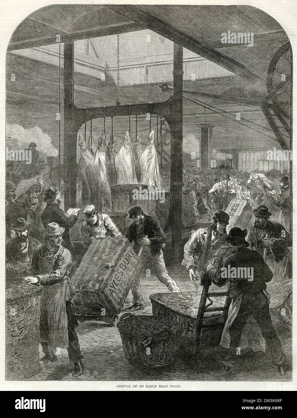 Arrival of meat at Smithfield Market, London, in 1870. The meat had just arrived by steam train (which can be seen in the background). In the centre of the image a number of sides of meat can be seen, hanging from hooks. In the foreground a large number of market porters move baskets of meat around.  1870 Stock Photo