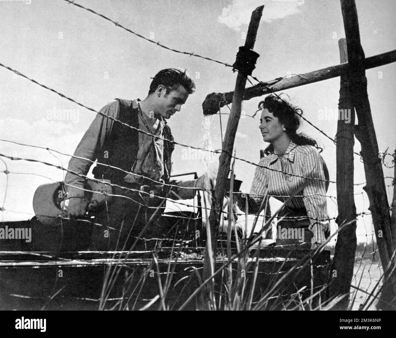 A film still of James Dean and Elizabeth Taylor in 'Giant.' This was the final film James Dean appeared in before his death.     Date: 19th December 1956, p700 Stock Photo