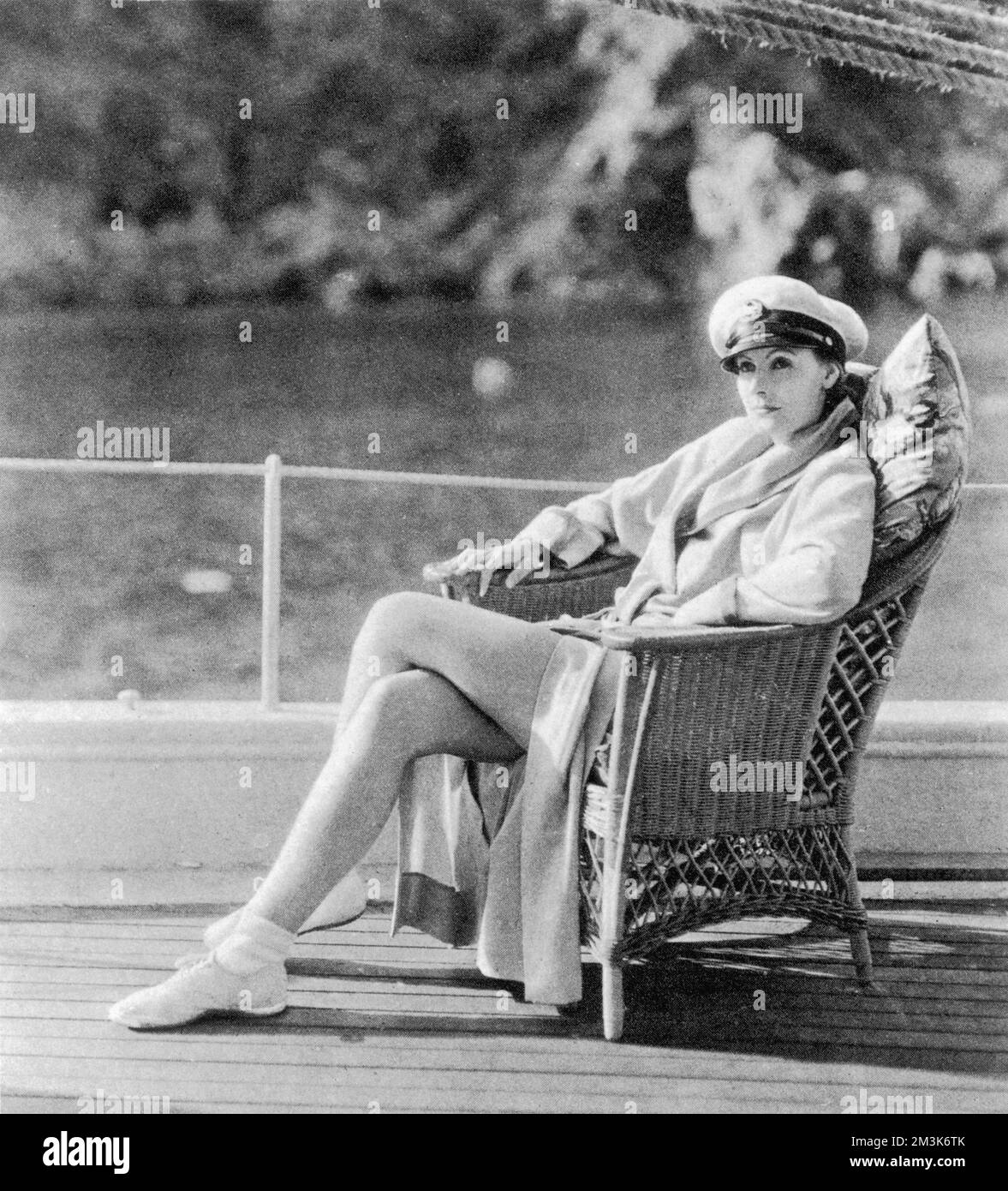 A portrait of Greta Garbo on her yacht off Catalina Island. Greta Garbo was born in Stockholm and was 'spotted' whilst studying at the Royal Theatre Dramatic School by the Swedish director Mauritz Stiller. Her first Hollywood film was 'The Temptress' 1926. Amongst her other successes are, 'Queen Christie' (1930), 'Anna Karenina' (1935) and 'Ninotchka' (1939). She retired from films in 1941, after receiving poor reviews for 'Two-Faced Woman' spending the rest of her life living as a recluse in New York.     Date: 31st July 1929 Stock Photo